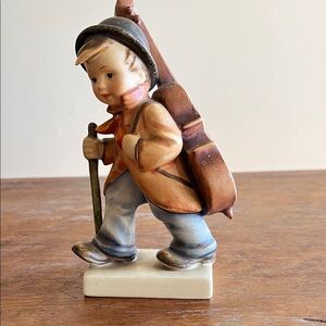 Vintage Boy Figurine with Orange and Blue Details